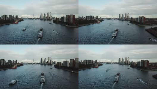 4k航拍鹿特丹运河、伊拉斯马斯布鲁格大桥和摩天大楼高清在线视频素材下载