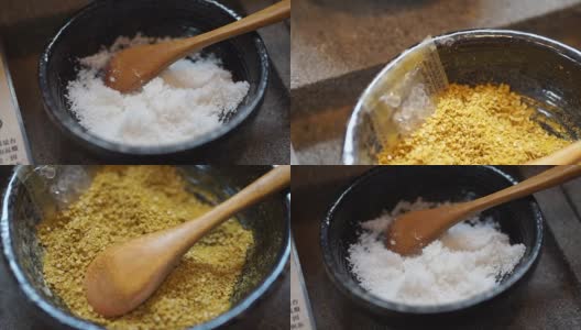 白海盐和咖喱，黄色盐与木勺碗高清在线视频素材下载