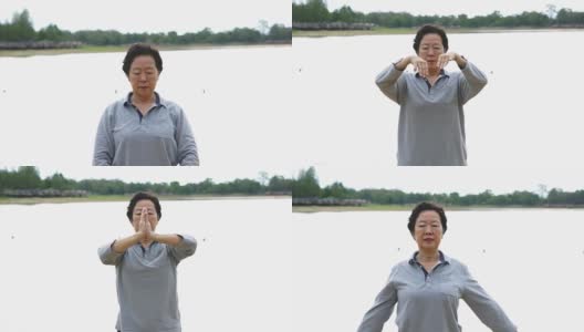 亚洲老人在湖边户外练习太极、气功的视频高清在线视频素材下载