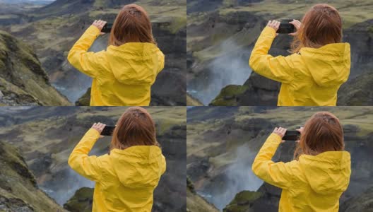 游客探索冰岛，拍摄它的峡谷高清在线视频素材下载
