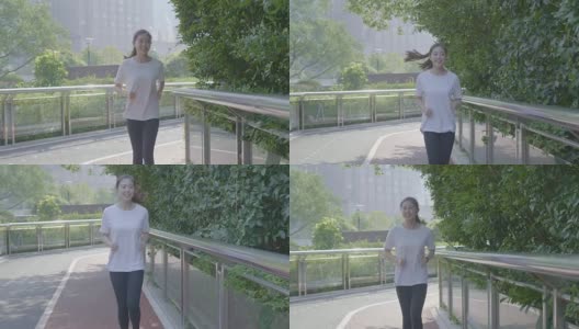 在城市环境中慢跑的亚洲女人高清在线视频素材下载