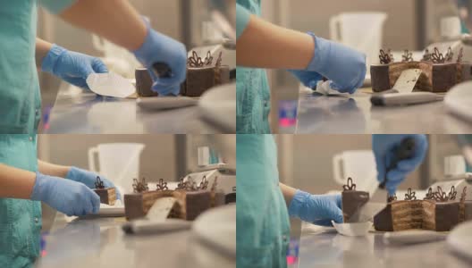 厨师面包师把一块巧克力蛋糕放在餐巾上的糖果店关闭高清在线视频素材下载