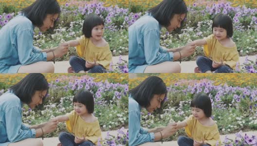 泰国母亲给女儿涂指甲。——股票视频高清在线视频素材下载