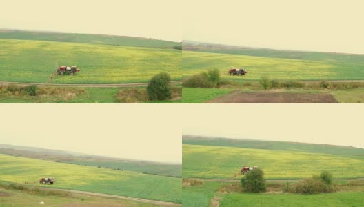 用油菜飞过田野。农用拖拉机喷洒夏季油菜田高清在线视频素材下载