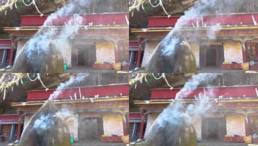 近距离观察:一座小修道院前燃烧的火炉冒出白烟高清在线视频素材下载