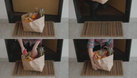 从门缝里拿出装新鲜水果的食品袋送外卖高清在线视频素材下载