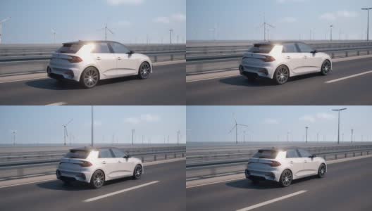 镜头跟随一辆自动驾驶的自动电动汽车驾驶，背景是风力涡轮机高清在线视频素材下载