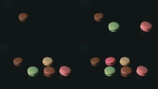 巧克力和粉色的法式杏仁饼干配上黑色的背景。美味的传统法式甜点。法国的奢华甜点。高清在线视频素材下载