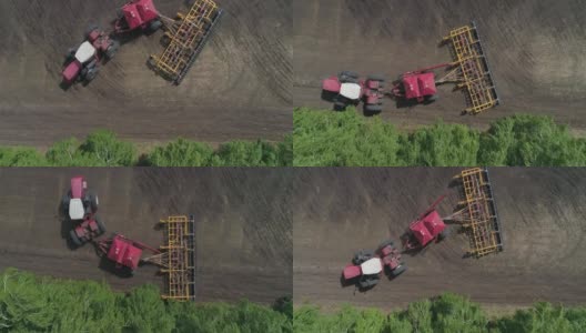鸟瞰图的拖拉机在田地里工作，播种和犁地的同时高清在线视频素材下载