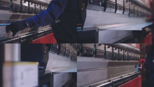 工人在工厂的现代弯曲工业机器上弯曲金属板。数控高清在线视频素材下载