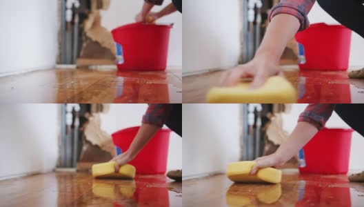 女人在家里擦漏水的水管的特写高清在线视频素材下载