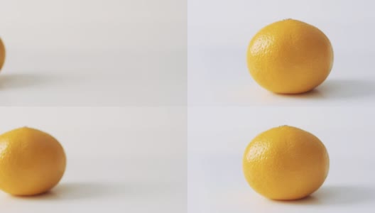多莉。成熟的橙子鲜柑橘，白色背景的橘子水果高清在线视频素材下载