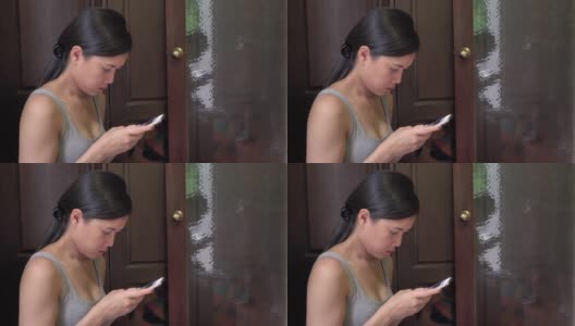 亚洲女人在酒店房间玩智能手机高清在线视频素材下载