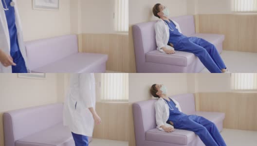年轻的亚洲医生坐在医院走廊感觉疲倦，沮丧，悲伤，疲劳，问题，倦怠压力和不安或担心的工作。医疗职业概念中的过度工作或工作量。高清在线视频素材下载
