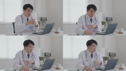 友好的亚洲医生男子视频呼叫在线交谈计算机远程健康。高清在线视频素材下载