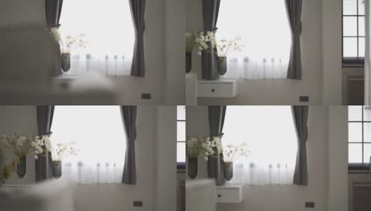 早晨阳光透过窗帘从卧室的窗户射进来高清在线视频素材下载
