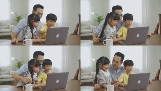 亚洲父亲和孩子们一起使用笔记本电脑高清在线视频素材下载