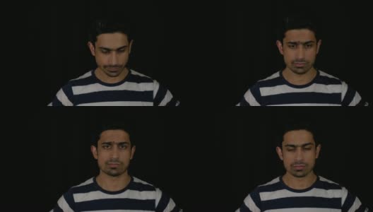 一名疲惫不堪的年轻印度男子失望地直视着镜头，没有改变面部表情高清在线视频素材下载