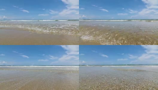 阳光明媚的泰国热带海景海滩，海浪拍打着沙滩，低角度视角，4K Dci分辨率高清在线视频素材下载