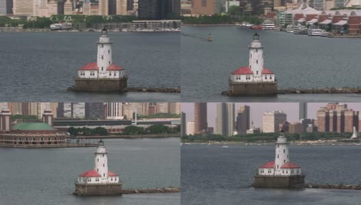 航拍芝加哥海港灯塔，以芝加哥市中心为背景。高清在线视频素材下载