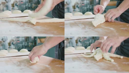 专业面包师正在烘焙商用厨房里制作面团。高清在线视频素材下载