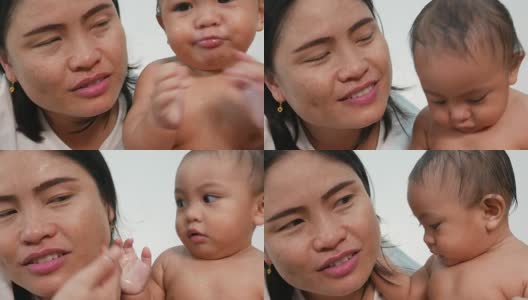 亚洲宝宝洗澡时和妈妈玩玩具高清在线视频素材下载