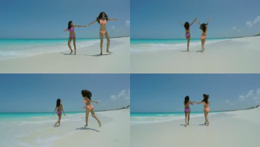年轻的非洲裔美国女孩穿着比基尼在海滩上高清在线视频素材下载
