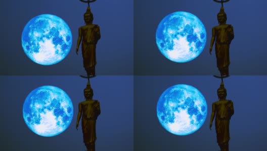 超级蓝满月移动在夜空和剪影佛高清在线视频素材下载