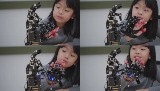 亚洲发明家孩子组装和测试机器人反应在实验室。建筑师小孩子设计电路技术想法和协作开发机器人。高清在线视频素材下载