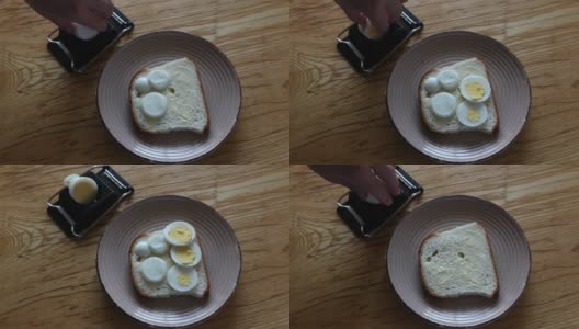 把切片鸡蛋放在白面包上高清在线视频素材下载