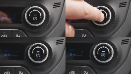 特写，按按钮打开汽车里的空调。男人的手按下了按钮高清在线视频素材下载