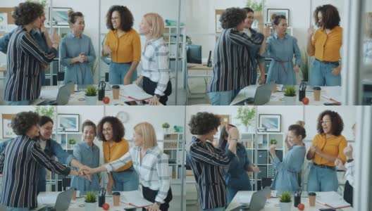 快乐的女性团队在工作场所一起举手击掌鼓掌高清在线视频素材下载