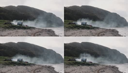 水面上的火的烟。捷里别尔卡河岸边。科拉半岛。巴伦支海。北高清在线视频素材下载