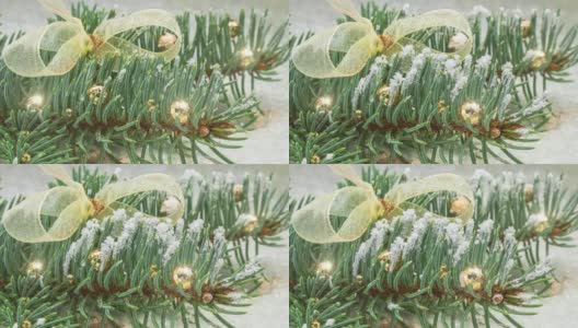 为圣诞节装饰的云杉树枝的特写镜头。冷冻冷杉枝，针叶上形成冰晶和雪晶。高清在线视频素材下载
