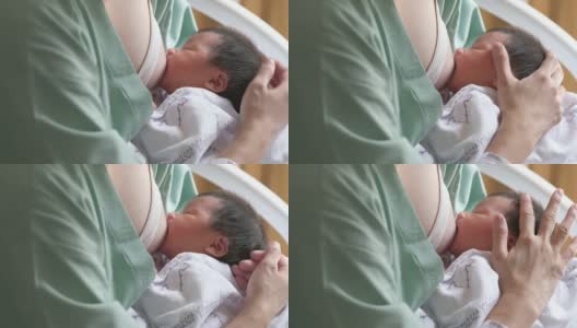母亲给婴儿喂奶高清在线视频素材下载