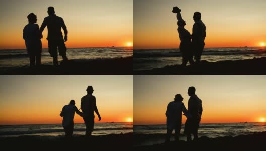 一对年轻夫妇在夕阳下的海滩上散步高清在线视频素材下载