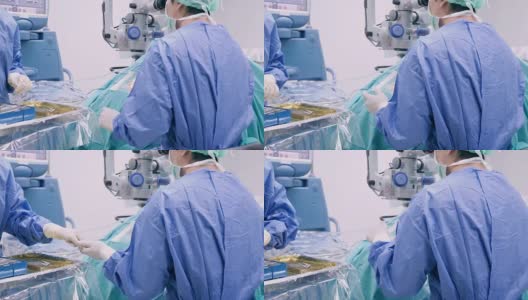仪器护士在手术过程中为眼科医生、外科医生增加手术工具，并在faco机的打字监视器触摸屏上进行眼、白内障手术、近景、手术高清在线视频素材下载