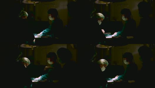 在手术室里给病人做手术的外科医生。高清在线视频素材下载