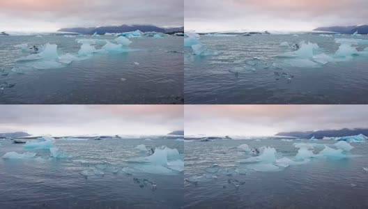 冰川泻湖，冰岛黑色海滩上的美丽日落高清在线视频素材下载