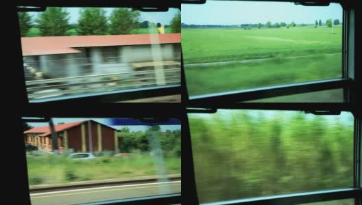 从火车窗口可以看到经过的乡村景观高清在线视频素材下载