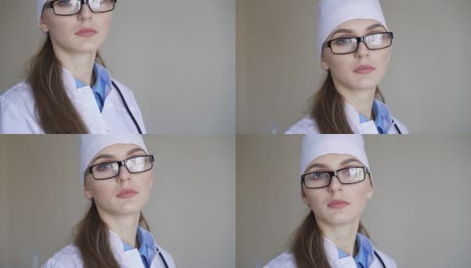 一个年轻的成年女医生的肖像，戴着眼镜，看着照相机高清在线视频素材下载