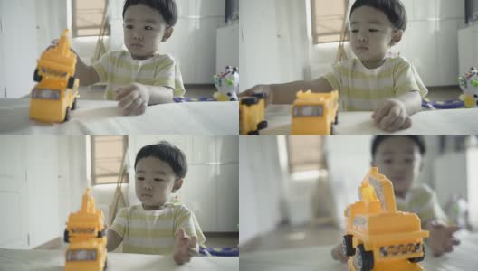 亚洲婴儿玩玩具汽车塑料高清在线视频素材下载