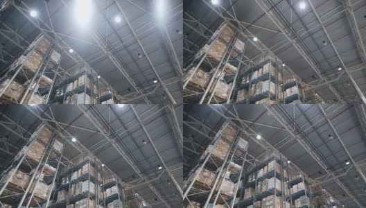 相机在仓库中与订购的货物和材料的调色板之间移动高清在线视频素材下载