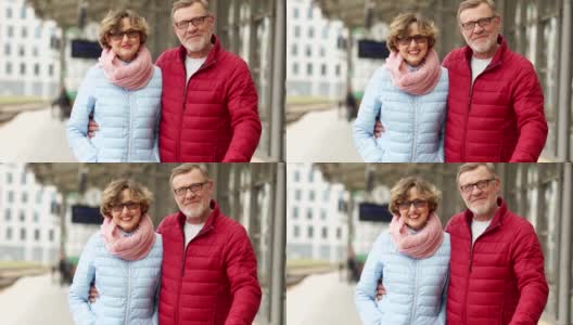 丈夫和妻子在春天散步穿过城市。看着画面，拥抱着笑。成熟的情侣约会高清在线视频素材下载