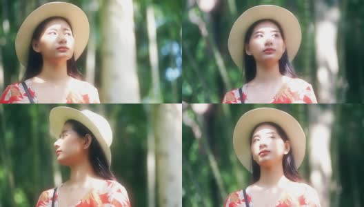 一位美丽的亚洲妇女戴着帽子环顾四周，阳光照在她的脸上高清在线视频素材下载