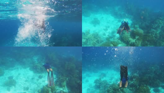 4K年轻人自由潜水穿着碳纤维长鳍潜水探索清澈的海水珊瑚礁在海洋高清在线视频素材下载