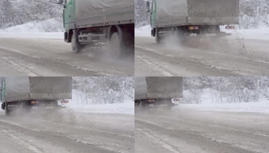 高速公路上，松散的雪花从卡车车轮下飞舞高清在线视频素材下载