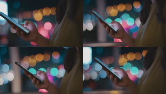 特写:在城市的夜晚使用智能手机高清在线视频素材下载