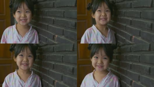 穿着粉红色日本连衣裙的亚洲女孩的肖像。高清在线视频素材下载