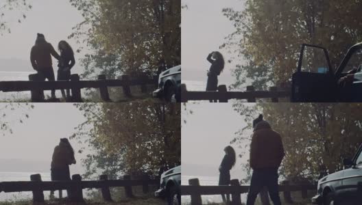 一对年轻夫妇在湖边拥吻高清在线视频素材下载